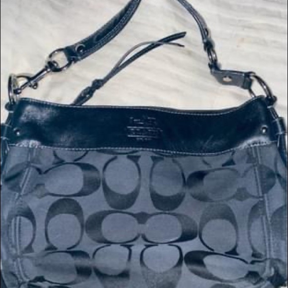 black zoe COACH bag with baby blue interior
